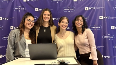 four music business students standing in front of a podium at the NYU Entrepreneurial Institute