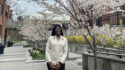 Professional photo of Faith Northern, cherry blossom trees in background