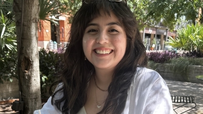 woman smiling at a garden