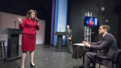 Actors on stage depicting political campaign