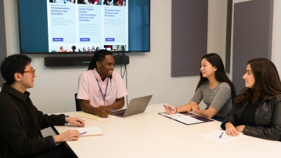 Master's students participating in group advising session
