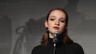 Girl on stage at microphone singing