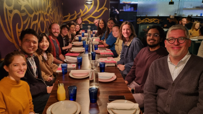 Group photo of team members at the table for a lab sponsored dinner
