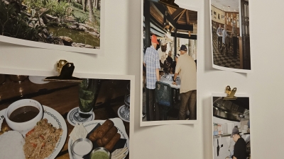 Food-related photography pinned to a wall.