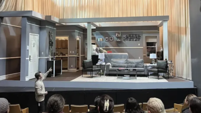 Professor showing students a stage setup