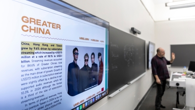 close up of Greater China on screen while teacher lectures in the background