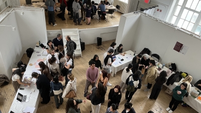 A group of VAA students gather in the Department's Commons exhibition space.