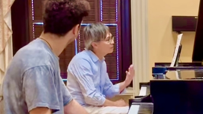 Professor working with piano student