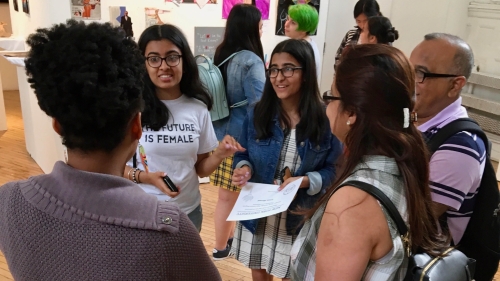Students at gallery show.