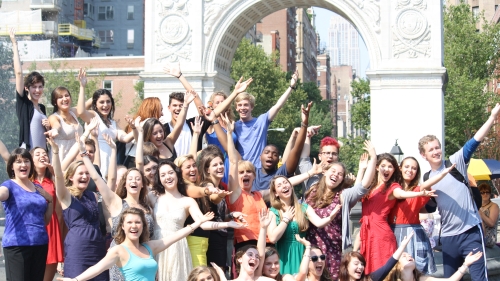 students in front of Washington Square Park arch