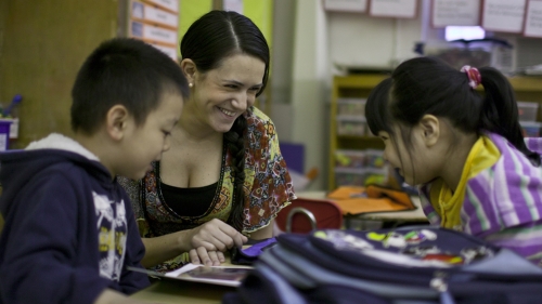 Two kindergarten students with teacher