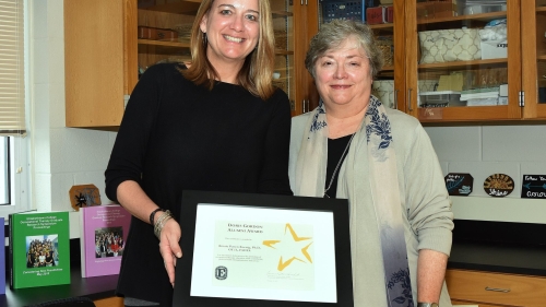 Dr. Kristie Patten Koenig receives the Doris Gordon Alumni Award last month at Homecoming
