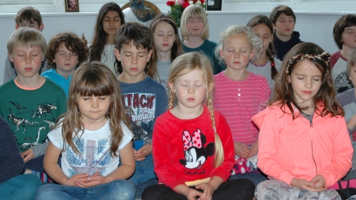 Primary school children meditating