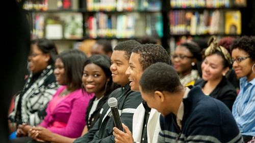 High school students attending a discussion