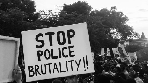 Protesters with sign: Stop Police Brutality