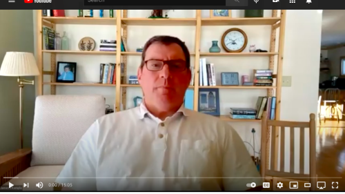 opening image of a youtube video featuring a man wearing a button up shirt and glasses