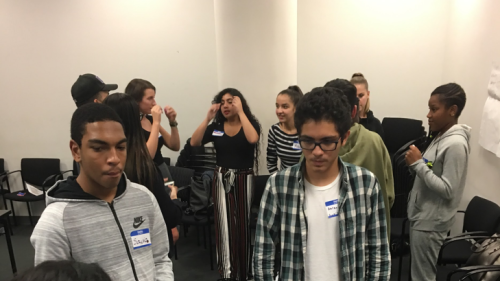 YTACD students in a circle formation engaged in small group discussions