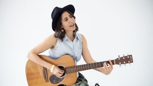 woman holding guitar