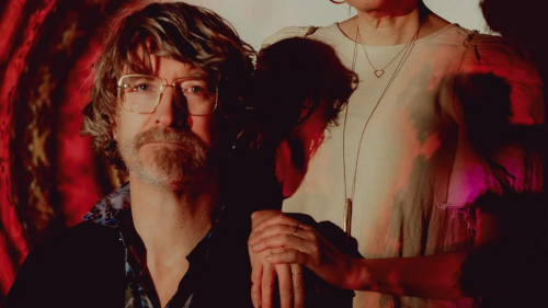 Kevin and Jennifer McCoy with “Quantum Leap,” a recent digital image offered for sale as an NFT, projected in their home studio in Greenpoint, Brooklyn. When Kevin created one of the first NFTs, it was to help guarantee digital artists an income.