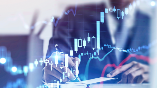 Man in suit in with graphics in front of him