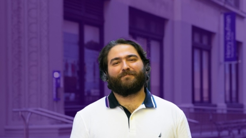 Marc Tohme stands in front of a purple background.