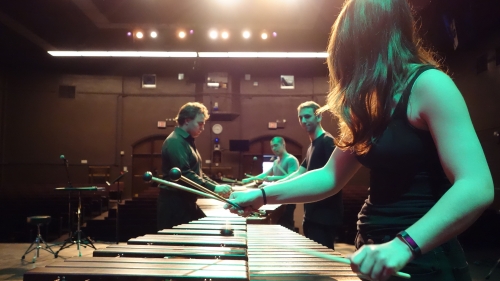 NYU students performing on percussion instruments