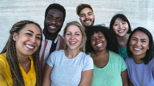 Photo of seven adults of various ethnicities.
