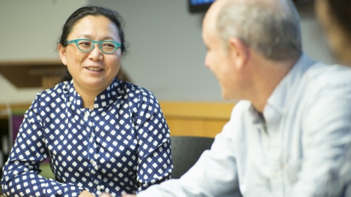 Man and woman faculty talking