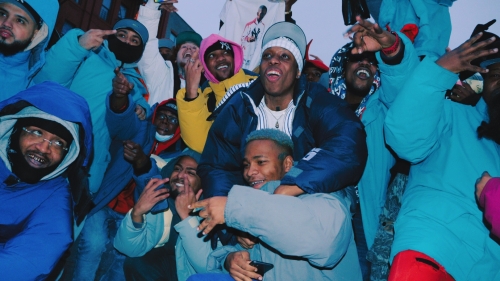 Group of Black men huddled in a circle