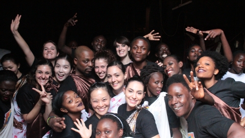 A large, diverse group of students pose for the camera.