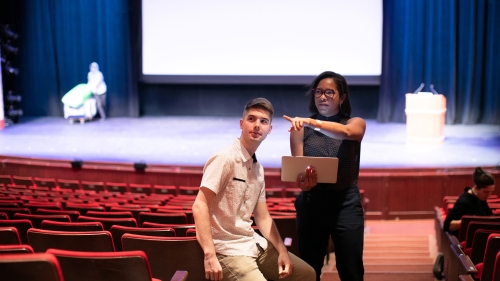 Two students working together in the theatre
