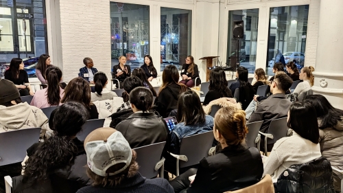 Large room filled with students facing panelists