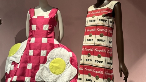 Photo of two mannequins wearing food-inspired dresses 