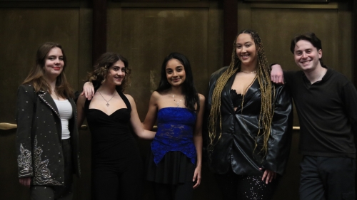 Five members from contemporary vocal ensemble posing together