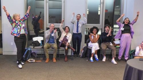 A group of people cheers