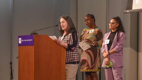 3 people present at a podium