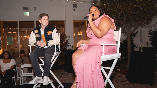 Noah Broxmeyer and Piper Page sit onstage