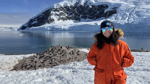 Soleil Sabalja stands near a glacier and smiles