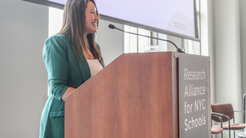 Melissa Aviles-Ramos stands at a podium