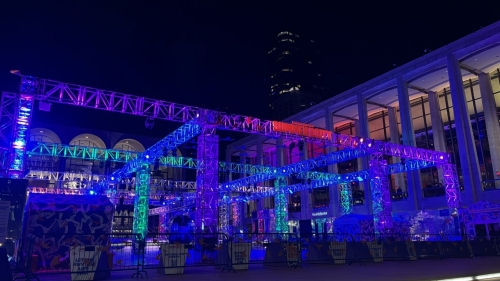 A Summer for the City stage at night, lit up in blue lights