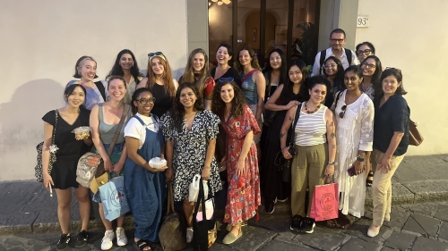 A group of people poses for the photo on the street