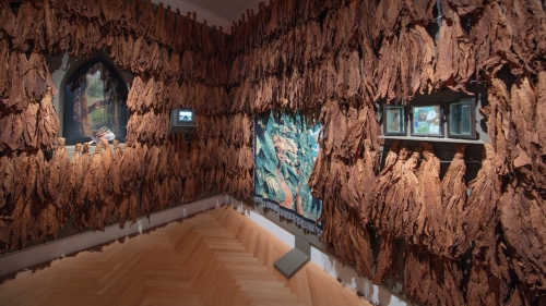 A gallery featuring a collection of AI-generated visual and archival media framed by tobacco leaves.