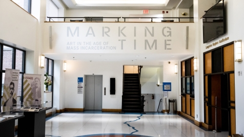 A hallway opening to the Marking Time exhibit