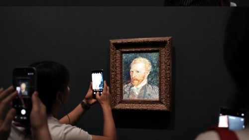 Two photos of museum goers taking digital photos of a portrait of Vincent Van Gogh.