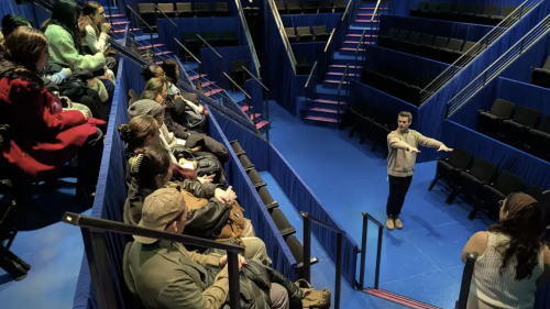 Employee from Majestic Theatre working with students in the theatre