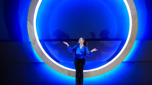 Student standing in the center of blue lit circle