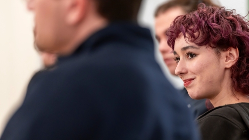 Close up of smiling student between two other students