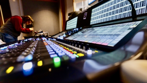 Student at the far end of Music Technology sound board