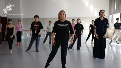 Deborah Damast demonstrating and leading a full studio dance class