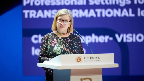 Deborah Damast speaks at a podium